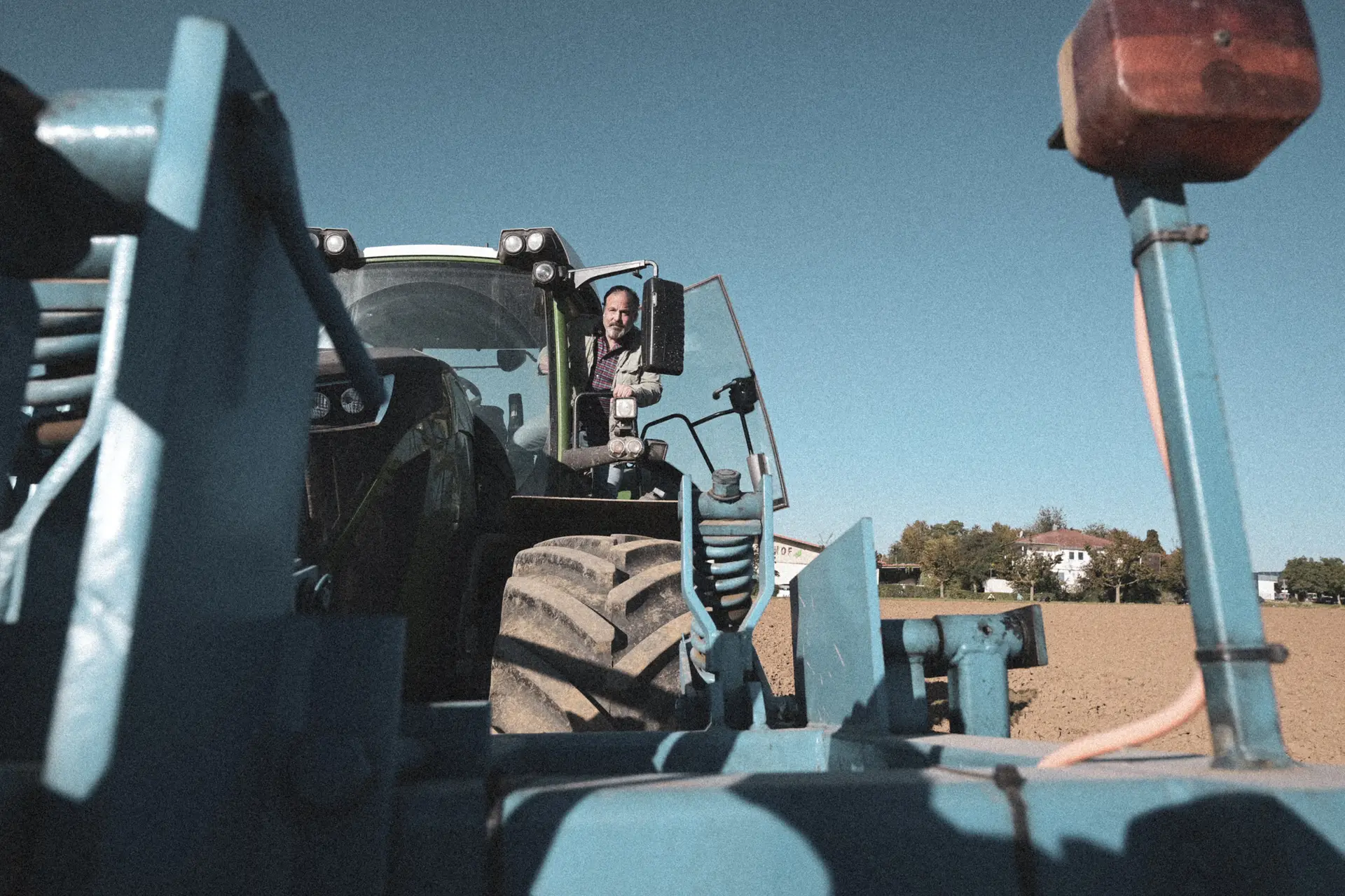 Tractor with implement in the field